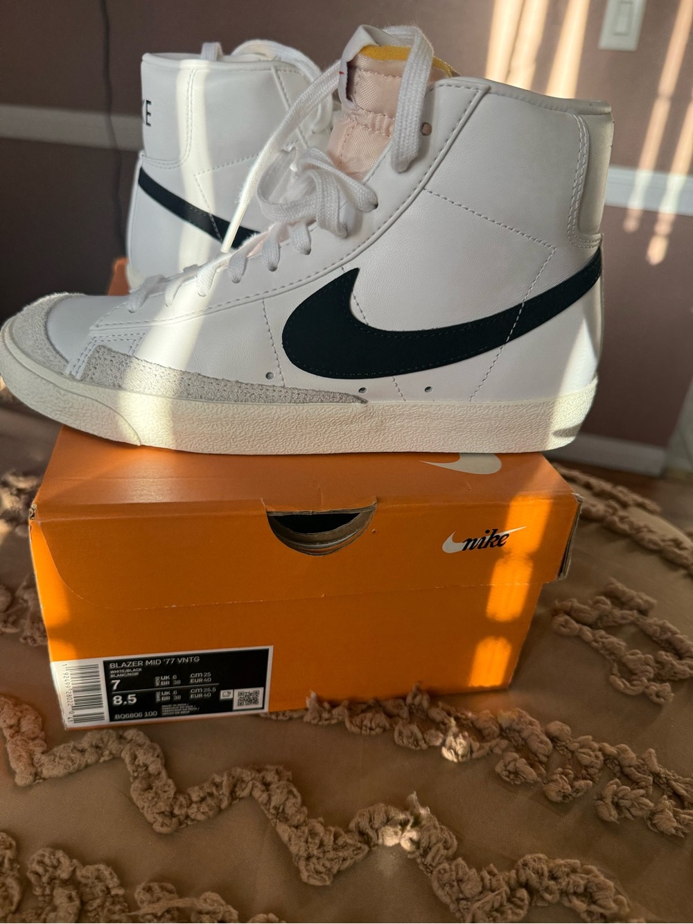 Nike White High-Top Sneakers with Black Swoosh